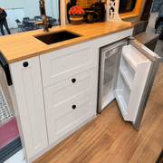 White Kitchen Cabinet with Fold-Out Bamboo Counter for Campervan | Vankea