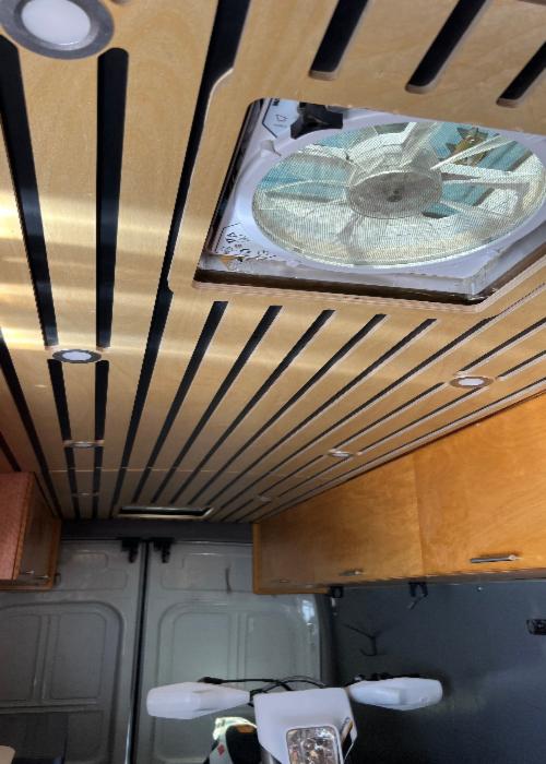 Wooden ceiling panels installed in a converted van