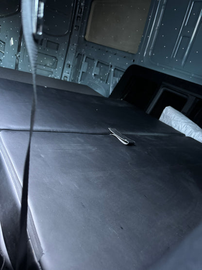 The seat folds flat to bed. Needs 72" by 47" space.